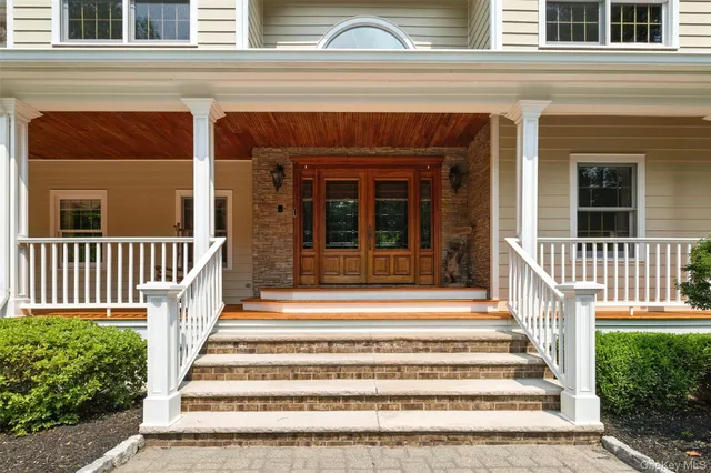a view of a house with a window and stairs
