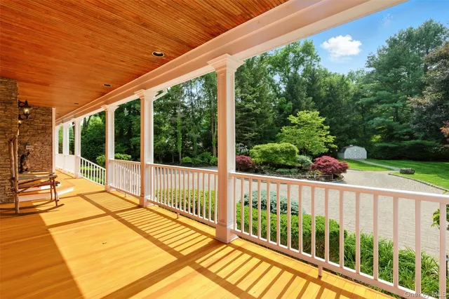 a view of a balcony with wooden floor