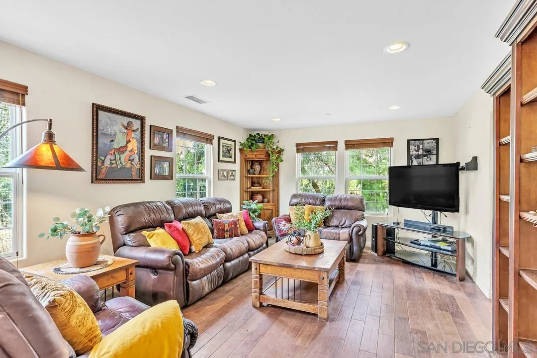 15127 Sycamore Canyon Road Poway, CA 92064 - Photo 11 of 47 a living room with furniture and a flat screen tv