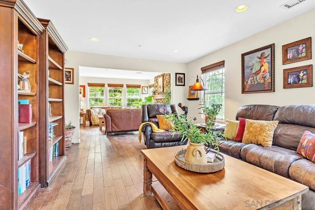 15127 Sycamore Canyon Road Poway, CA 92064 - Photo 13 of 47 a living room with furniture and a wooden floor