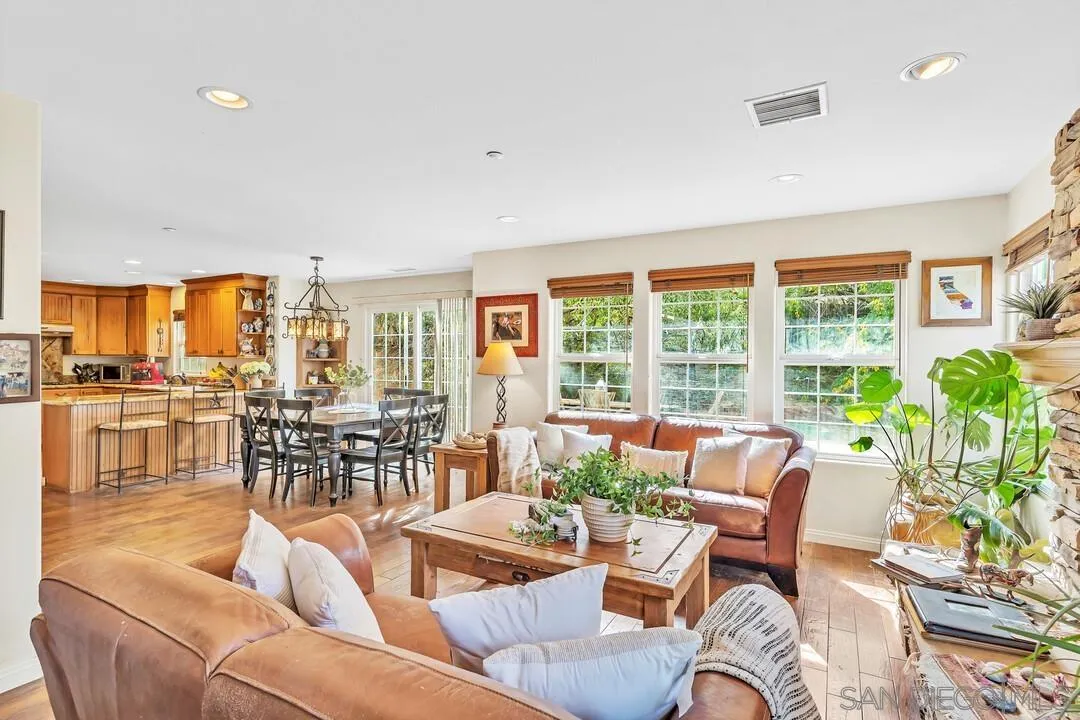 15127 Sycamore Canyon Road Poway, CA 92064 - Photo 16 of 47 a living room with furniture and a large window with garden view