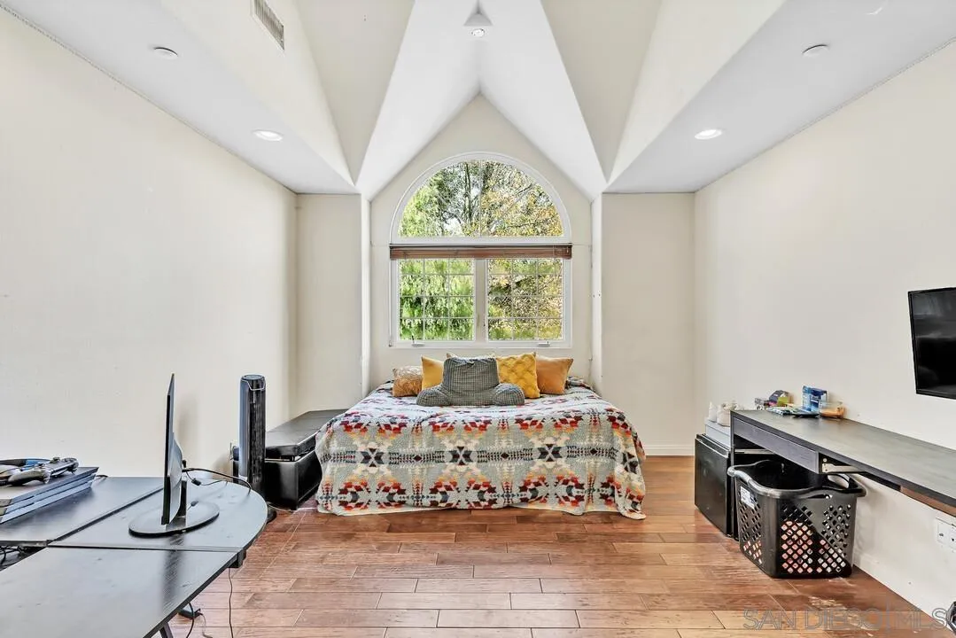 15127 Sycamore Canyon Road Poway, CA 92064 - Photo 29 of 47 a bedroom with a bed and a window