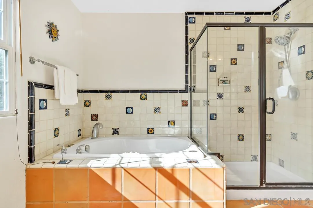 15127 Sycamore Canyon Road Poway, CA 92064 - Photo 33 of 47 a bathroom with a granite countertop sink mirror and shower