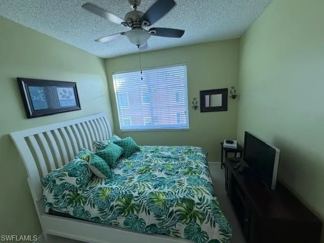 a view of a balcony with table and chairs