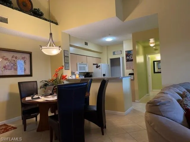 a couple of cars parked in front of a building