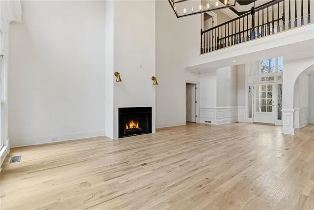 a view of a house with a large space and wooden floor