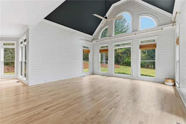 a kitchen with stainless steel appliances granite countertop a sink and wooden cabinets