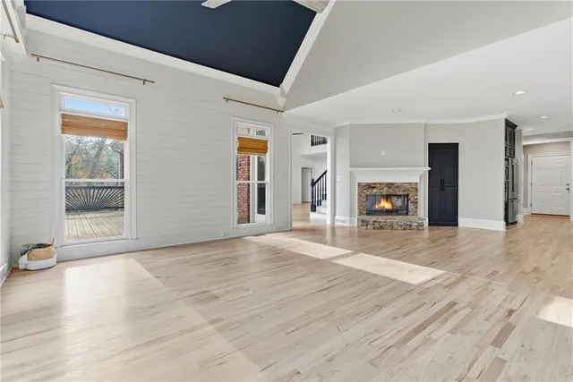 a kitchen with stainless steel appliances granite countertop a sink a stove and a refrigerator