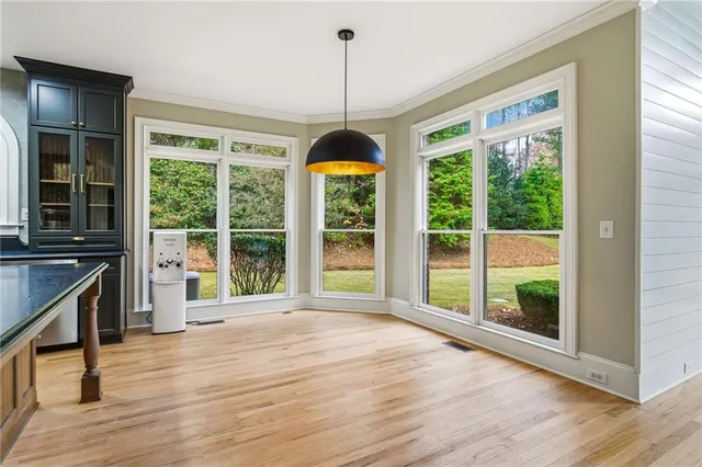 a stove top oven sitting inside of a kitchen