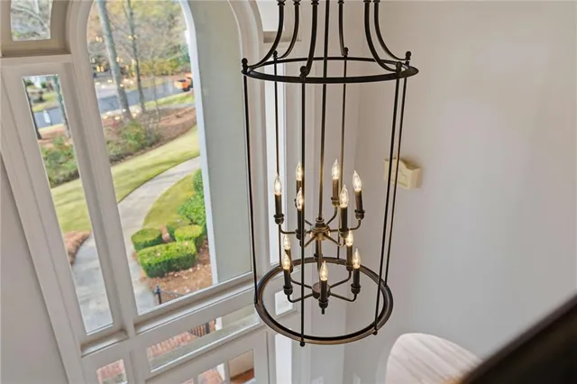 a front view of a house with yard patio and swimming pool