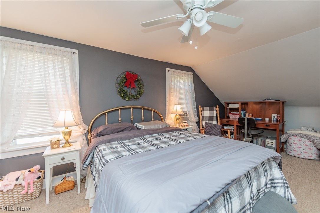 5364 Summit Road Lyndhurst, OH 44124 - Photo 17 of 42 Bedroom featuring a pitched ceiling, carpet flooring, and a white ceiling fan with integrated lighting
