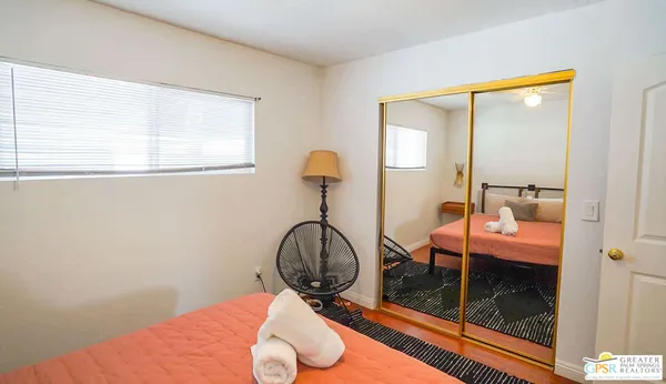 a room with view of bathroom and mirror