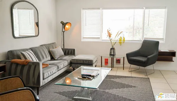 a living room with furniture and a window