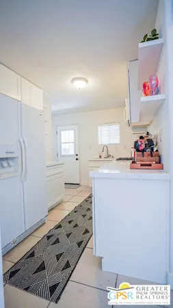 a kitchen that has a lot of cabinets in it