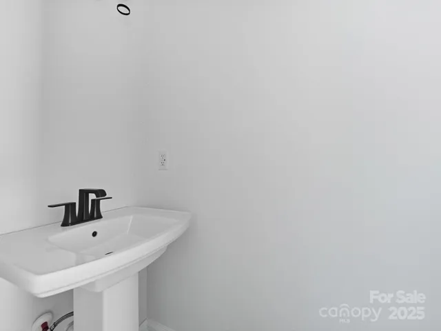 a bathroom with a sink and mirror