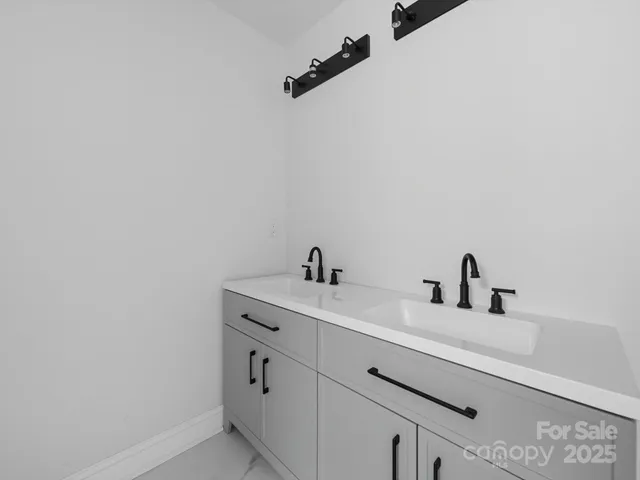 a bathroom with a sink and vanity