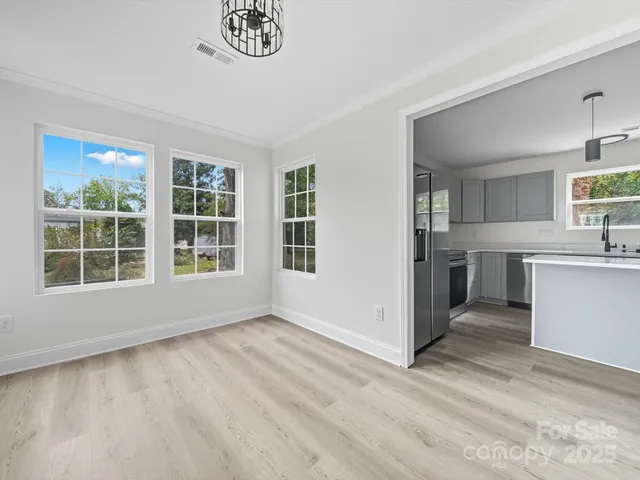 a view of a kitchen with a sink cabinets and a window