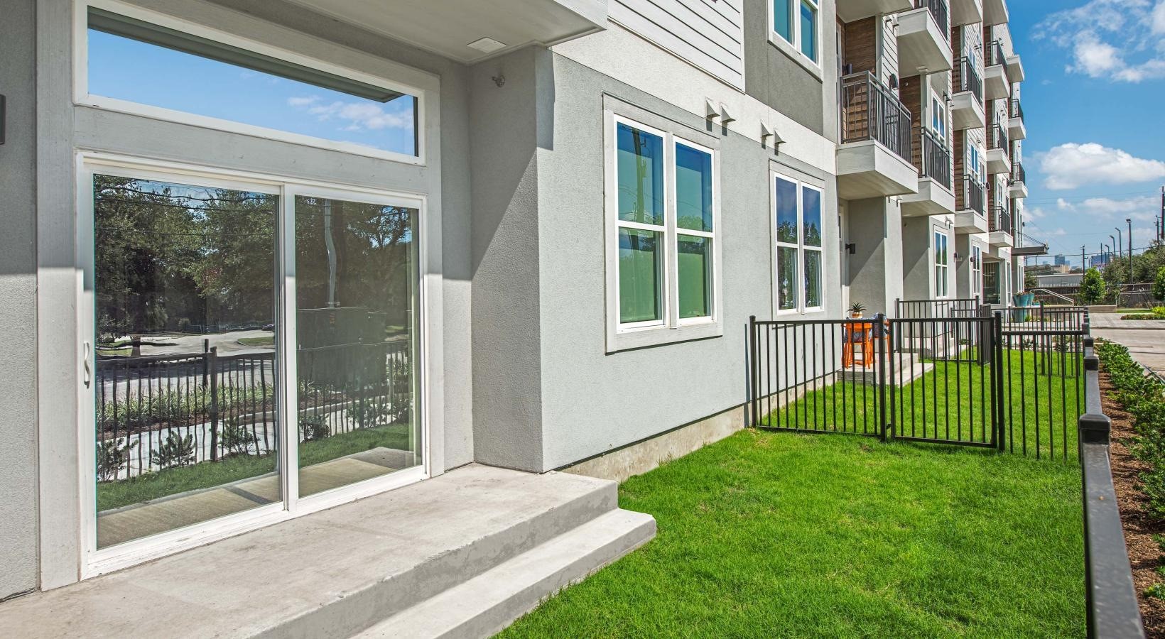 9330 South Main Street, Unit 326 Houston, TX 77025 - Photo 6 of 24 a view of a house with a yard and sitting area