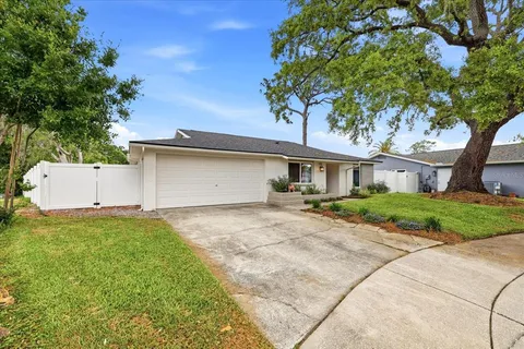 a front view of house with yard and green space