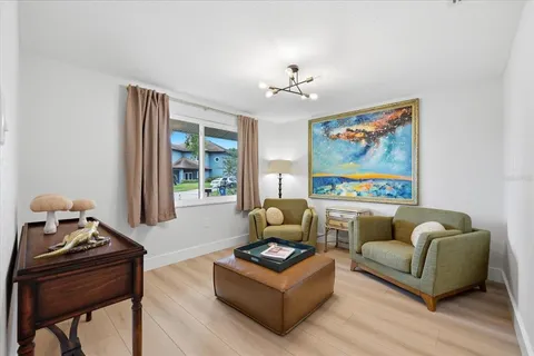 a living room with furniture and a window