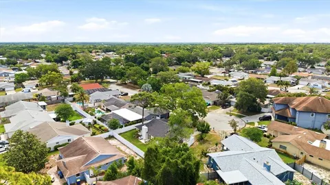 an aerial view of residential houses with outdoor space