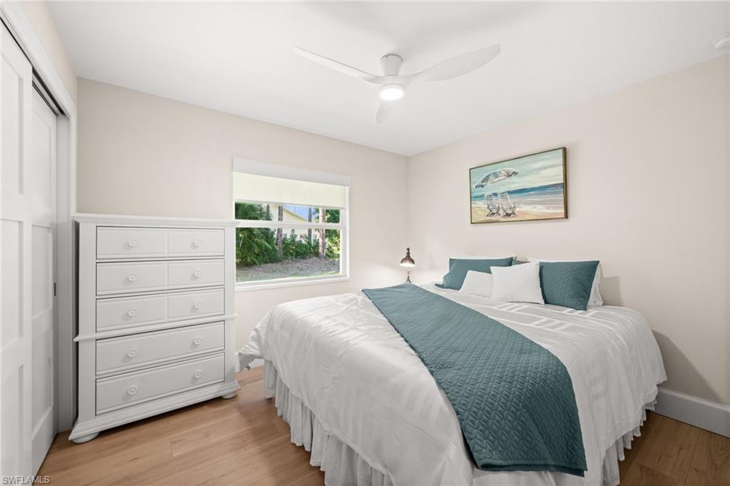 1925 Imperial Golf Course Boulevard Naples, FL 34110 - Photo 30 of 45 Serene and welcoming, this guest bedroom offers fresh natural light, soothing tones, and a relaxing atmosphere for visitors.