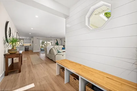 an entryway with wooden floor