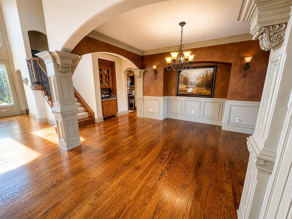 7005 Peter's Path Colleyville, TX 76034 - Photo 15 of 40 a view of a hallway with wooden floor and stairs