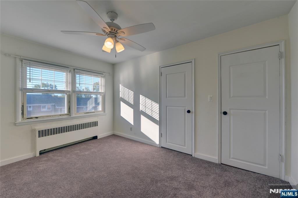 255 Bogert Road, Unit 2A River Edge, NJ 07661 - Photo 15 of 25 a view of an empty room with a window