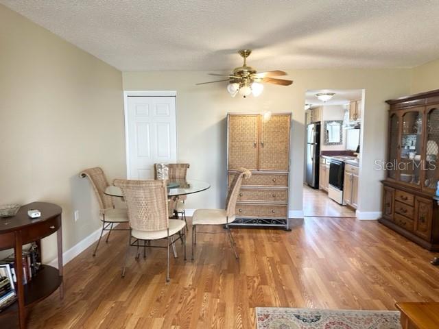 7701 Starkey Road, Unit 731 Seminole, FL 33777 - Photo 5 of 19 a living room with furniture and a wooden floor