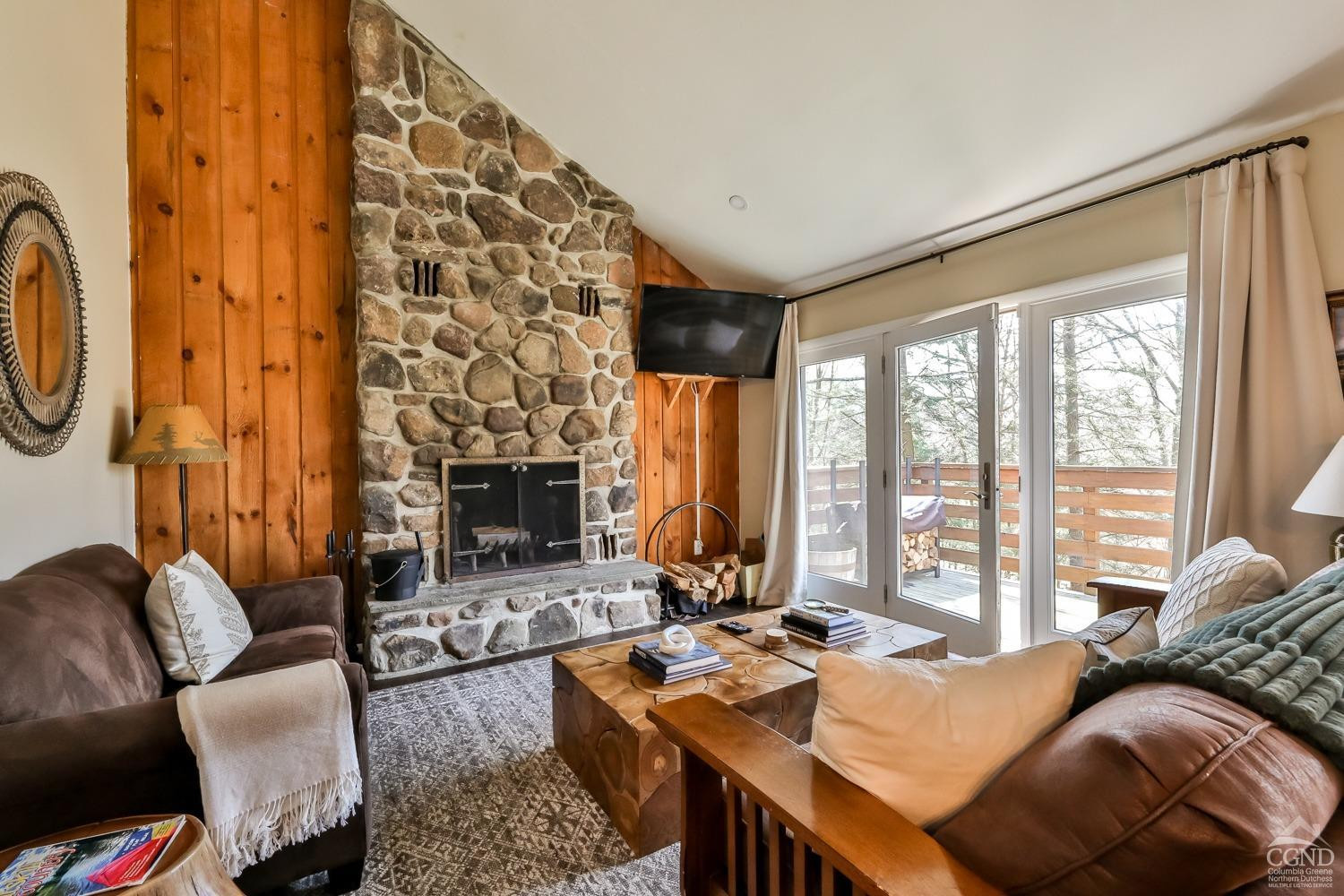 110-2 Highridge Road Windham, NY 12439 - Photo 10 of 48 a living room with furniture a fireplace and floor to ceiling windows