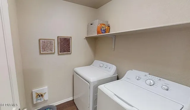 a bedroom with a bed and a lamp