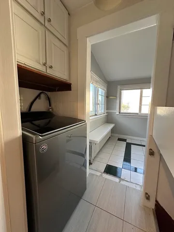 a bathroom with a toilet and a shower curtain