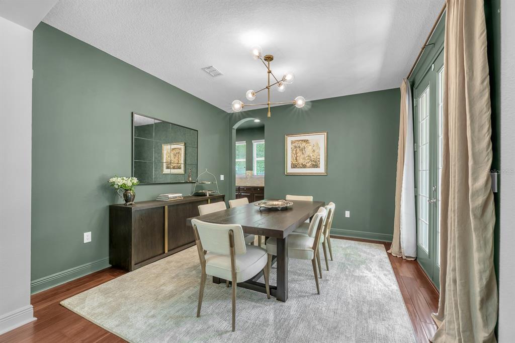 5310 Fishhawk Ridge Drive Lithia, FL 33547 - Photo 6 of 52 a view of a dining room with furniture and a chandelier
