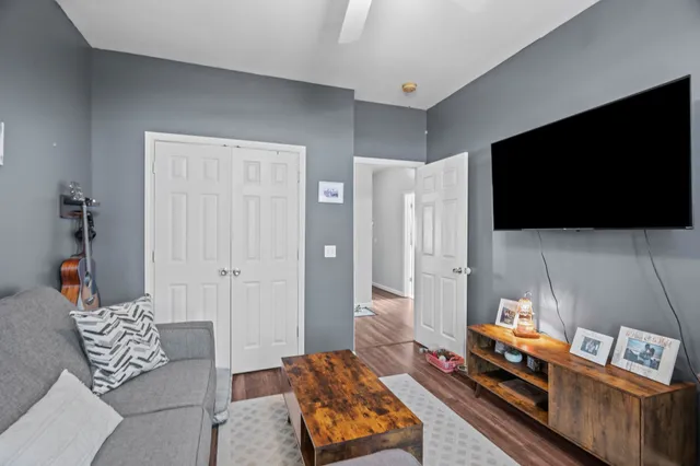 a bathroom with a granite countertop toilet sink and mirror