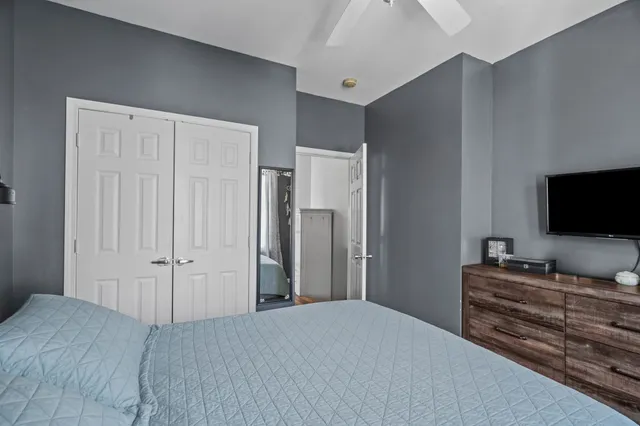 a bedroom with a bed and a window