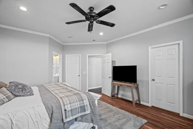 a bathroom with a tub a sink and mirror