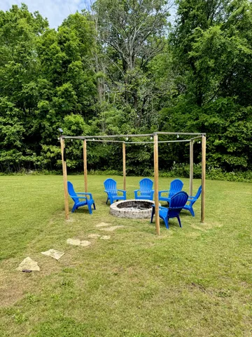a view of a swimming pool with an outdoor space and seating area