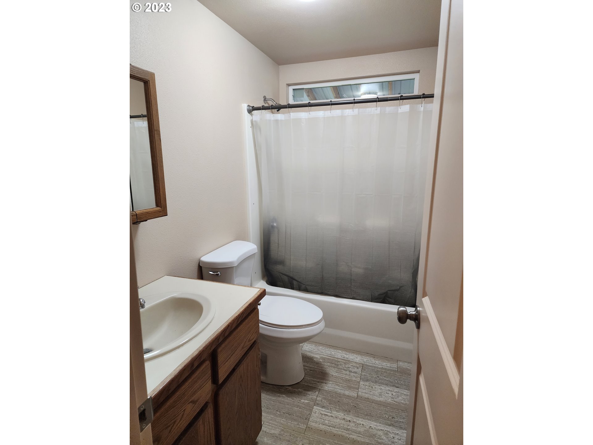 314 Northeast 209th Street Ridgefield, WA 98642 - Photo 11 of 17 a bathroom with a granite countertop sink toilet and shower