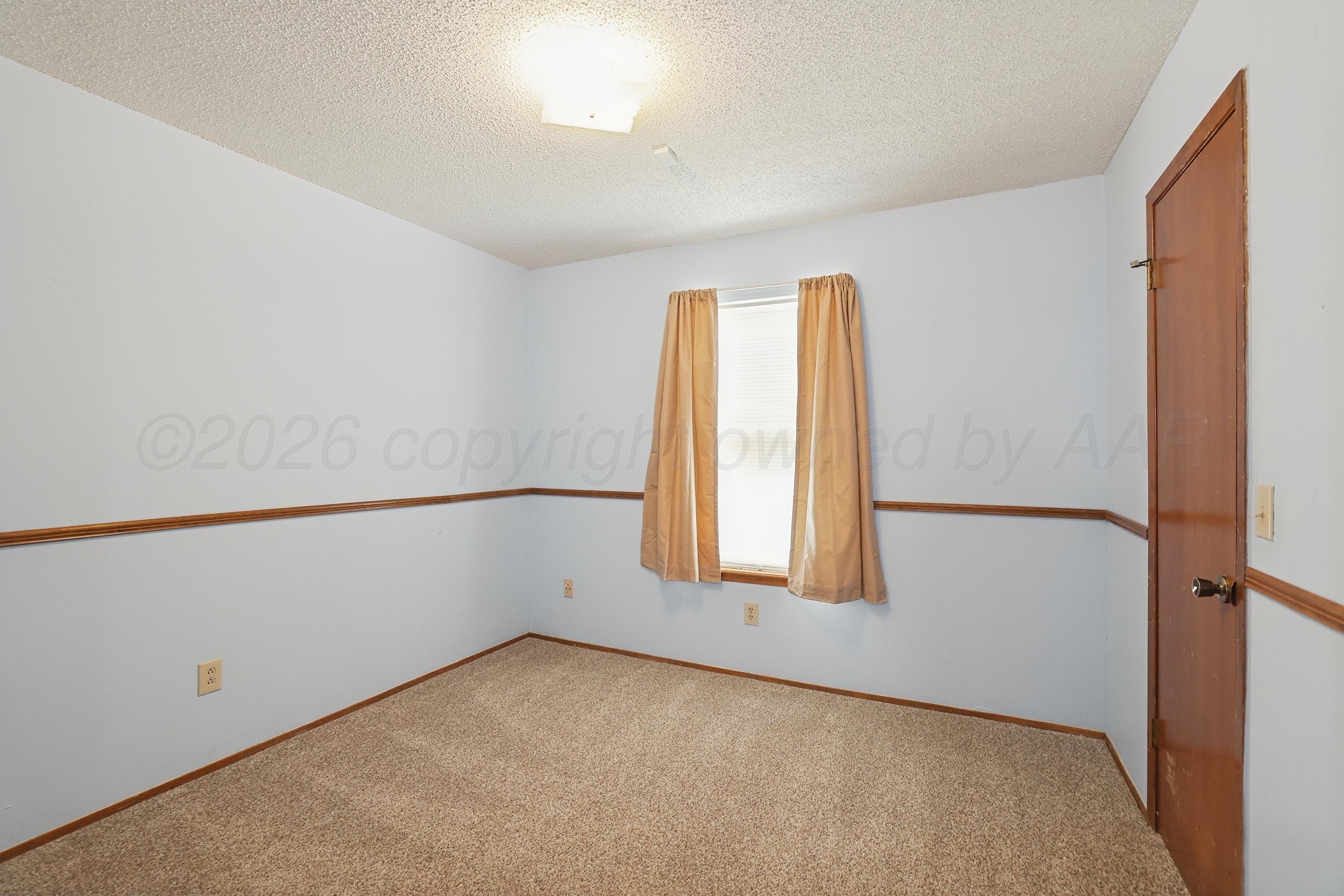 5102 Raindrop Lane Amarillo, TX 79110 - Photo 16 of 28 17-2nd Bedroom