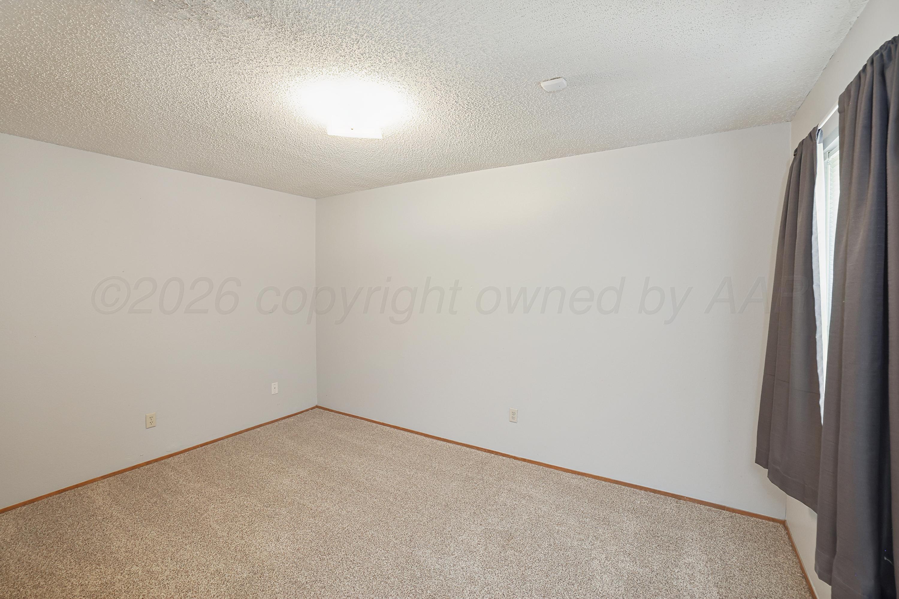 5102 Raindrop Lane Amarillo, TX 79110 - Photo 18 of 28 19-3rd Bedroom