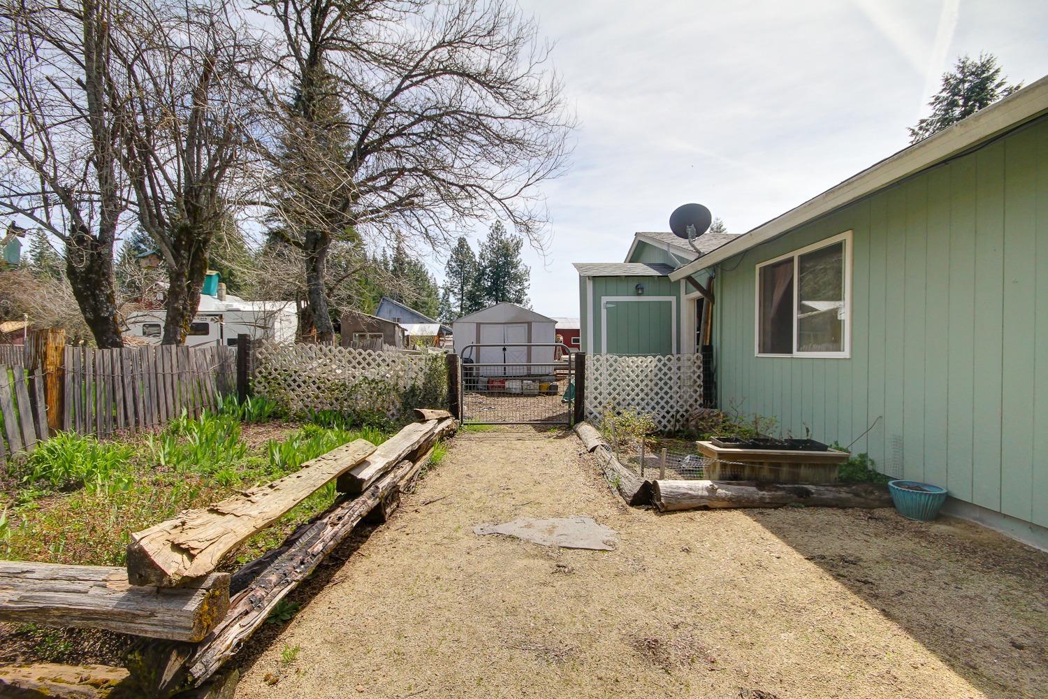 407 Shady Lane Prospect, OR 97536 - Photo 30 of 35 Garden beds and gated area with shed