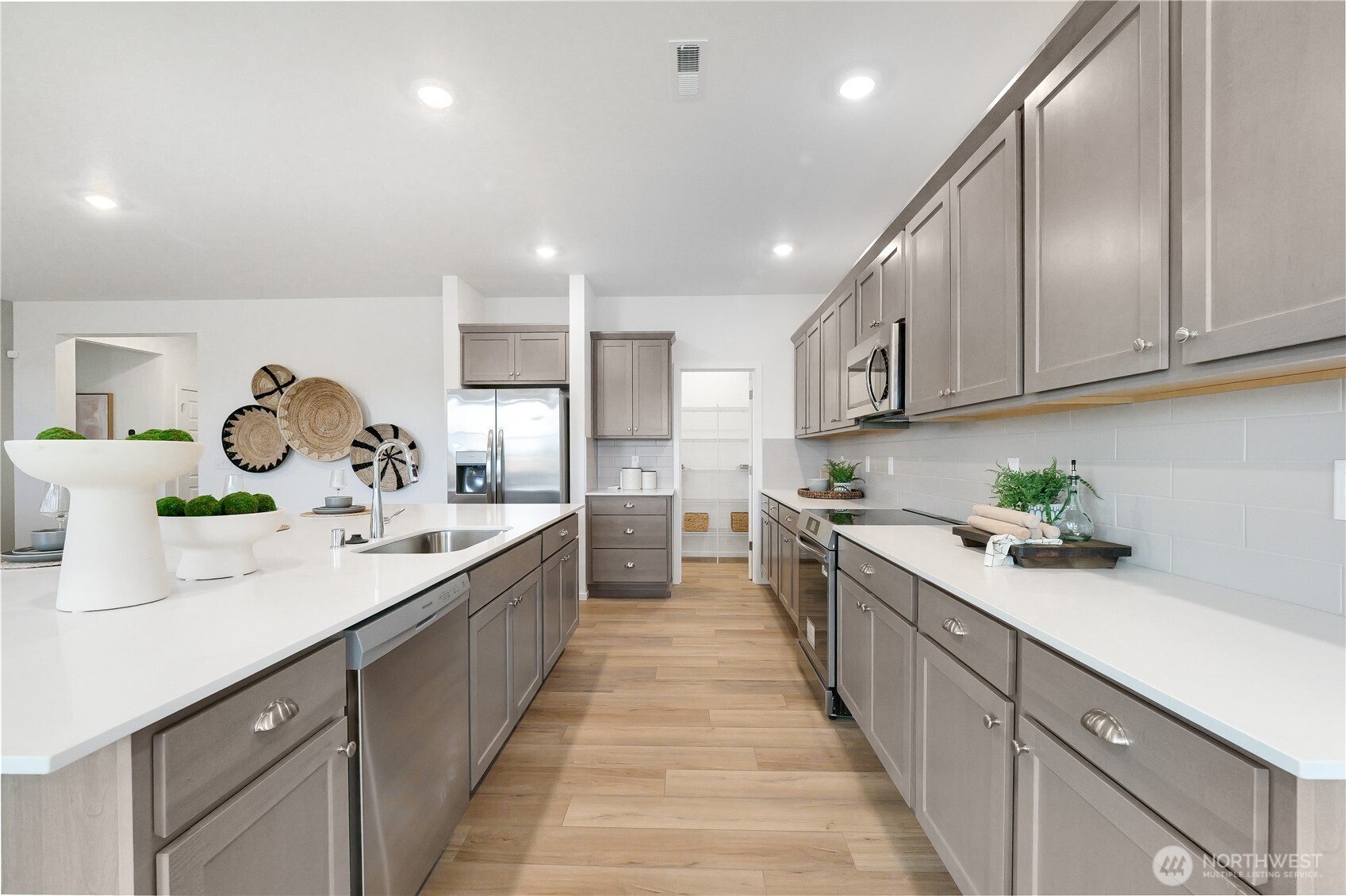 72 Moonshadow Lane Sequim, WA 98382 - Photo 4 of 27 a kitchen with a sink a stove and cabinets
