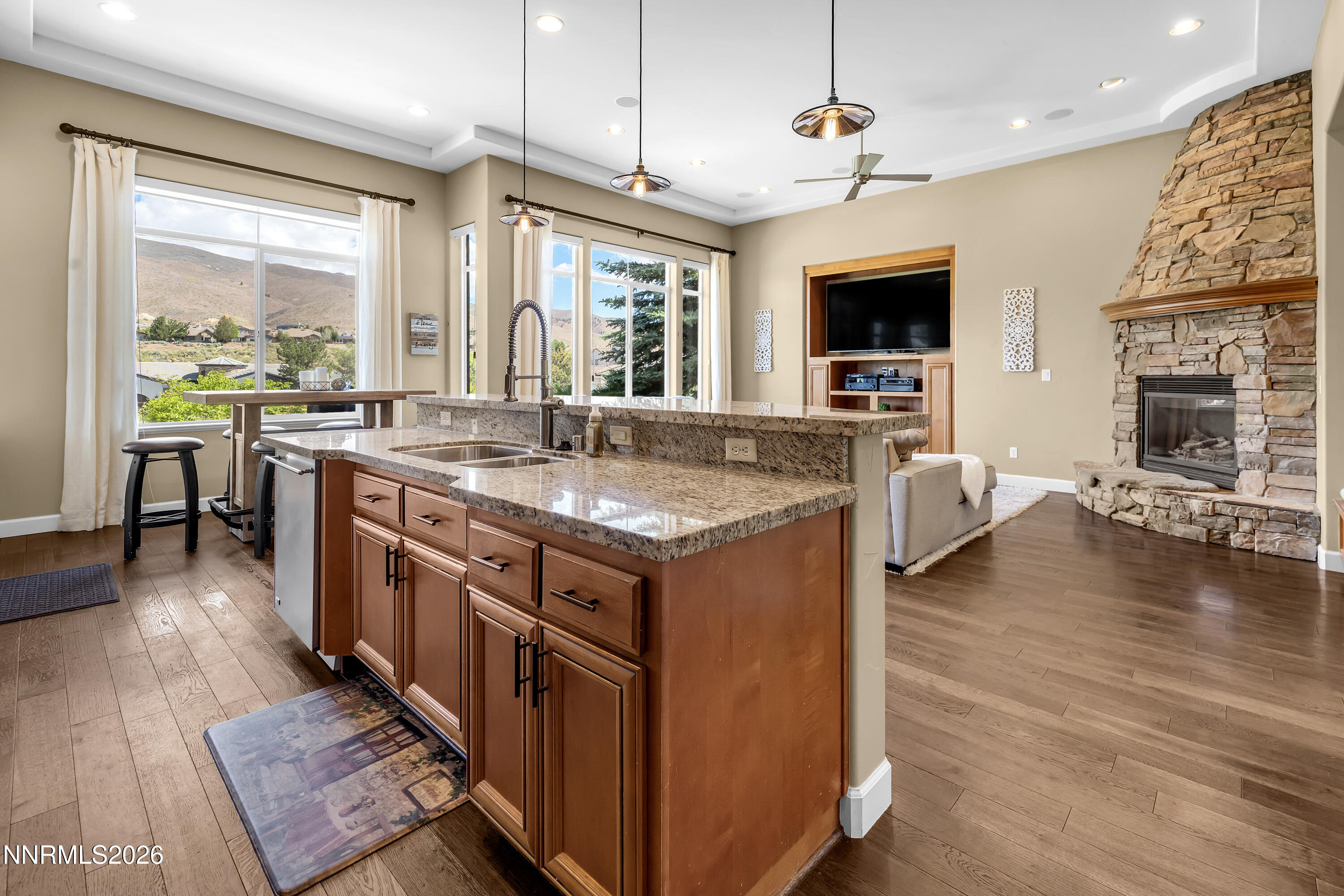 1898 Laurel Ridge Drive Reno, NV 89523 - Photo 4 of 87 a kitchen with stainless steel appliances granite countertop a stove and a wooden floors