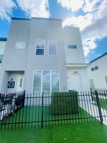 a view of a house and a yard