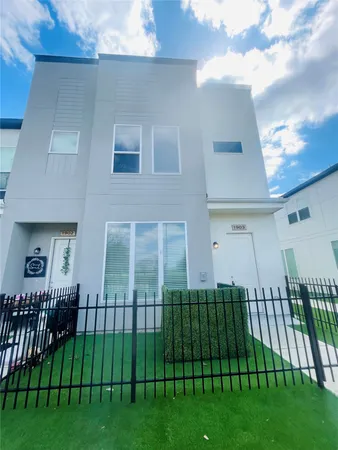 a view of a house and a yard