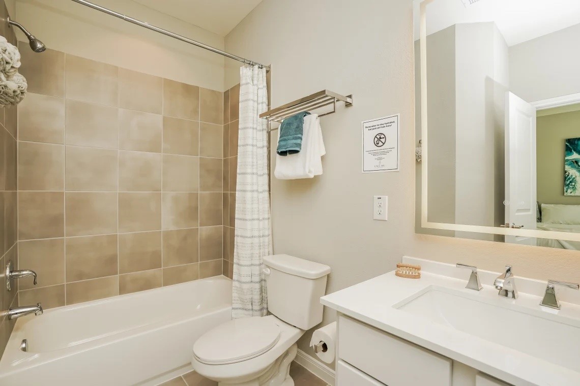 21455 Merchant's Way, Unit 103 Katy, TX 77449 - Photo 13 of 20 a bathroom with a sink toilet and shower