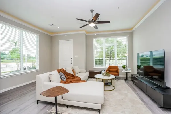 a living room with furniture and a flat screen tv