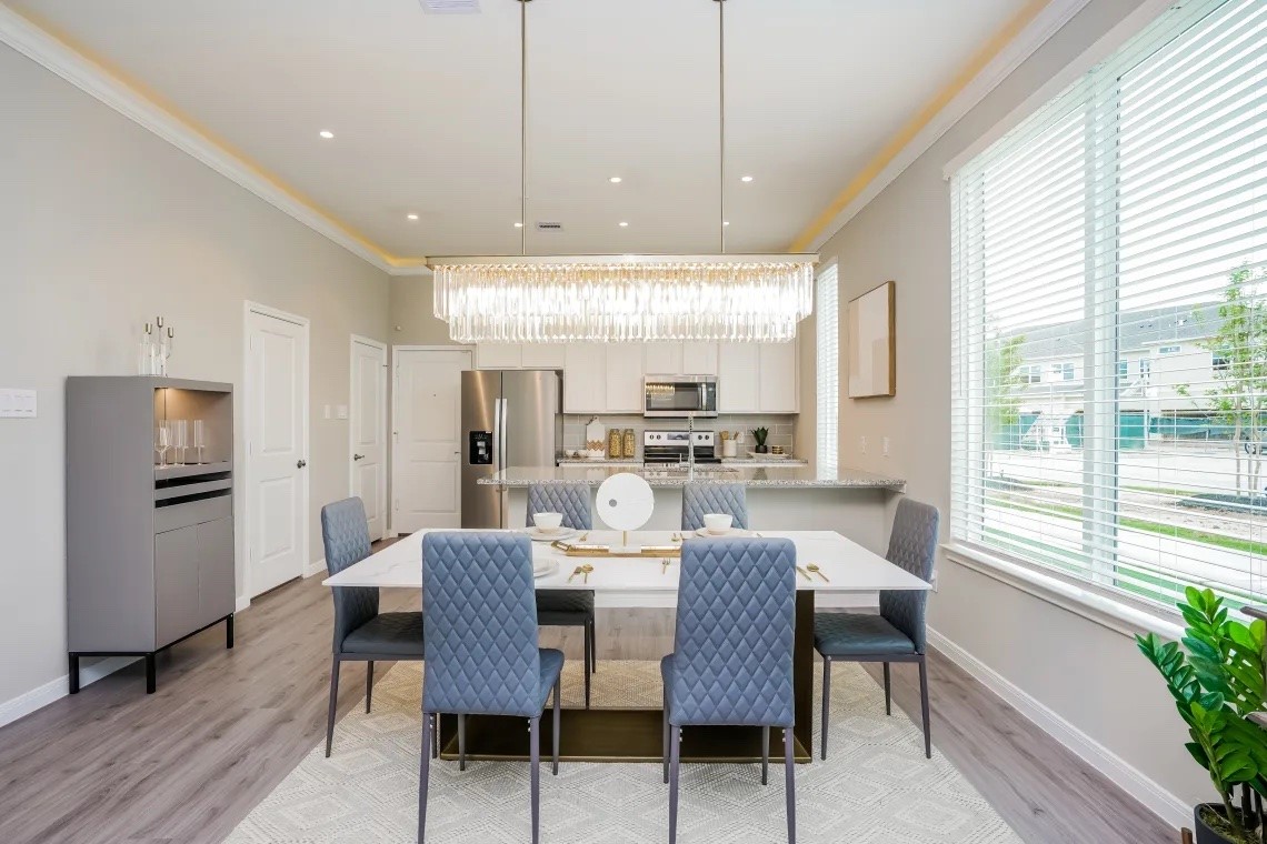 21455 Merchant's Way, Unit 103 Katy, TX 77449 - Photo 6 of 20 a view of a dining room with furniture window and wooden floor
