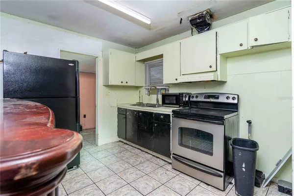 a kitchen with a sink and cabinets
